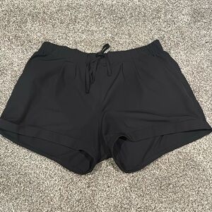 Black ZYIA summer shorts. Medium. One small imperfection shown in photo.
